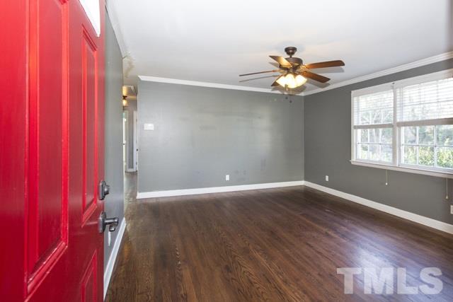 1212 North King Charles Road Raleigh, NC 27610 - Photo 3 of 16 wooden floor in an empty room with a window