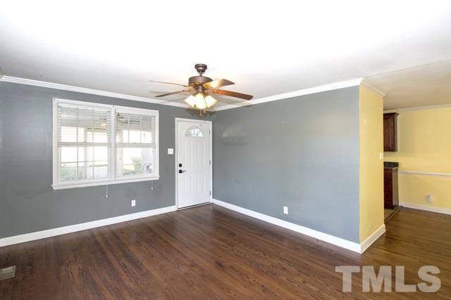 1212 North King Charles Road Raleigh, NC 27610 - Photo 6 of 16 wooden floor in an empty room with a window