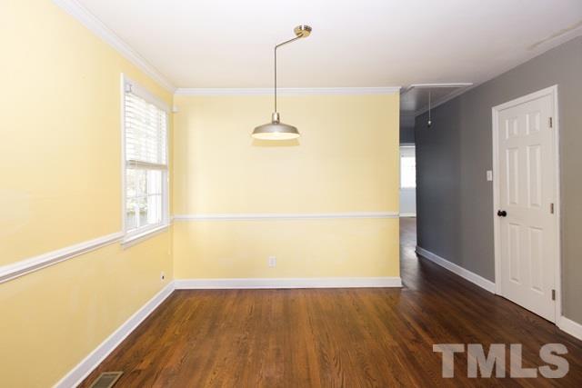 1212 North King Charles Road Raleigh, NC 27610 - Photo 7 of 16 a view of a room with wooden floor and a window