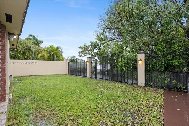 a backyard of a house with lots of green space