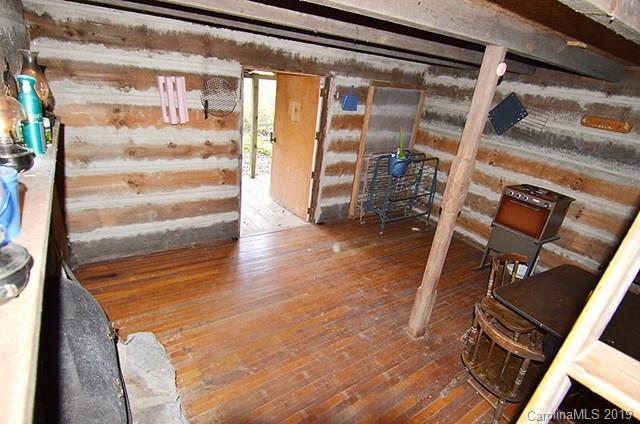 V/l Henry Mc Call Road, Unit NONE Marion, NC 28752 - Photo 16 of 18 a view of stairs and an empty room with wooden floor