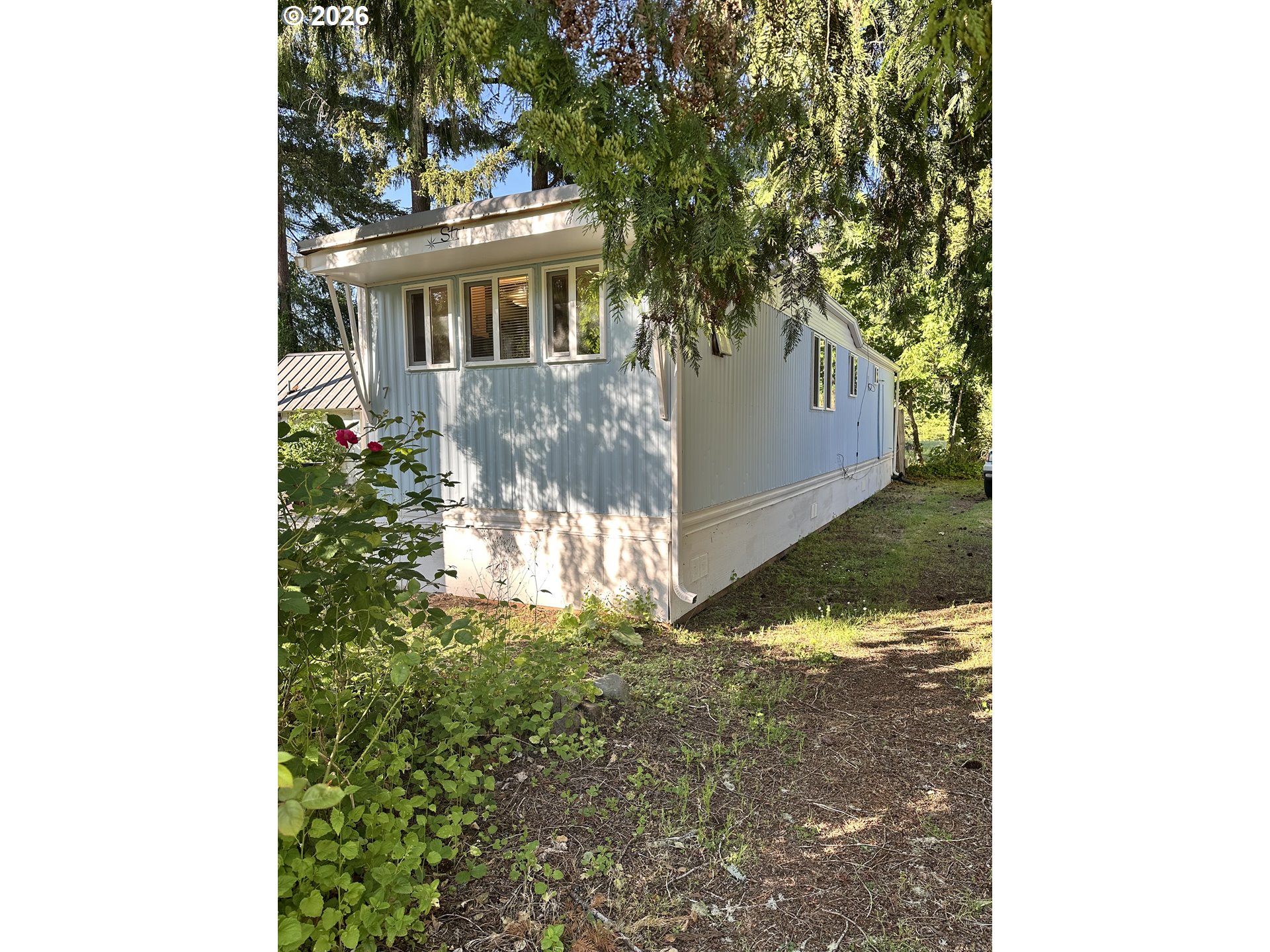 37635 Row River Road, Unit 7 Dorena, OR 97434 - Photo 1 of 27 a view of a house with a yard