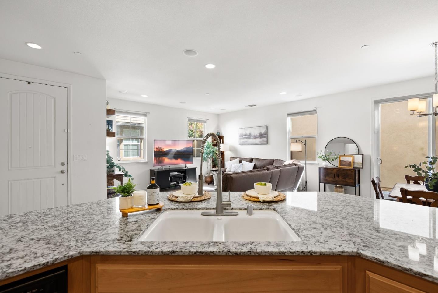 94 Caspian Way Gilroy, CA 95020 - Photo 16 of 40 a living room with fireplace furniture and a wooden floor