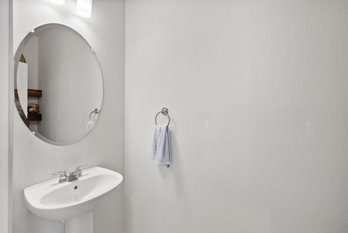 94 Caspian Way Gilroy, CA 95020 - Photo 19 of 40 a bathroom with a sink and mirror