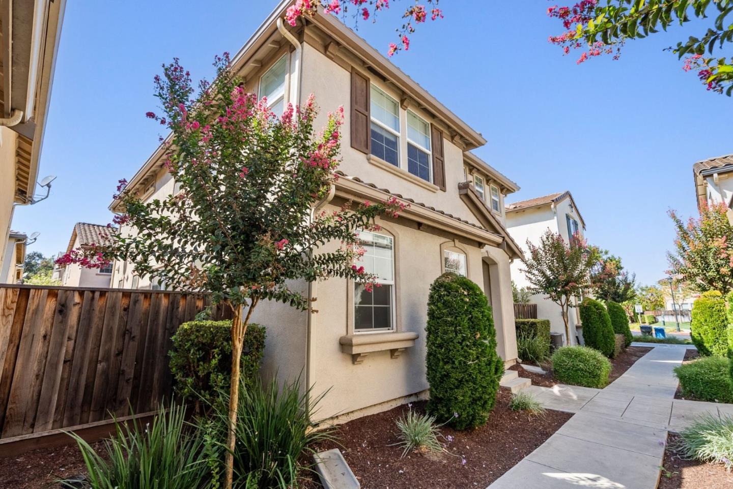 94 Caspian Way Gilroy, CA 95020 - Photo 2 of 40 a front view of a house with garden