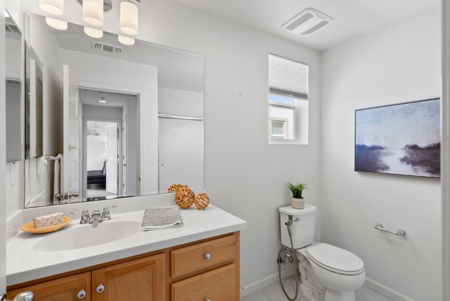 94 Caspian Way Gilroy, CA 95020 - Photo 24 of 40 a bathroom with a granite countertop sink mirror and toilet