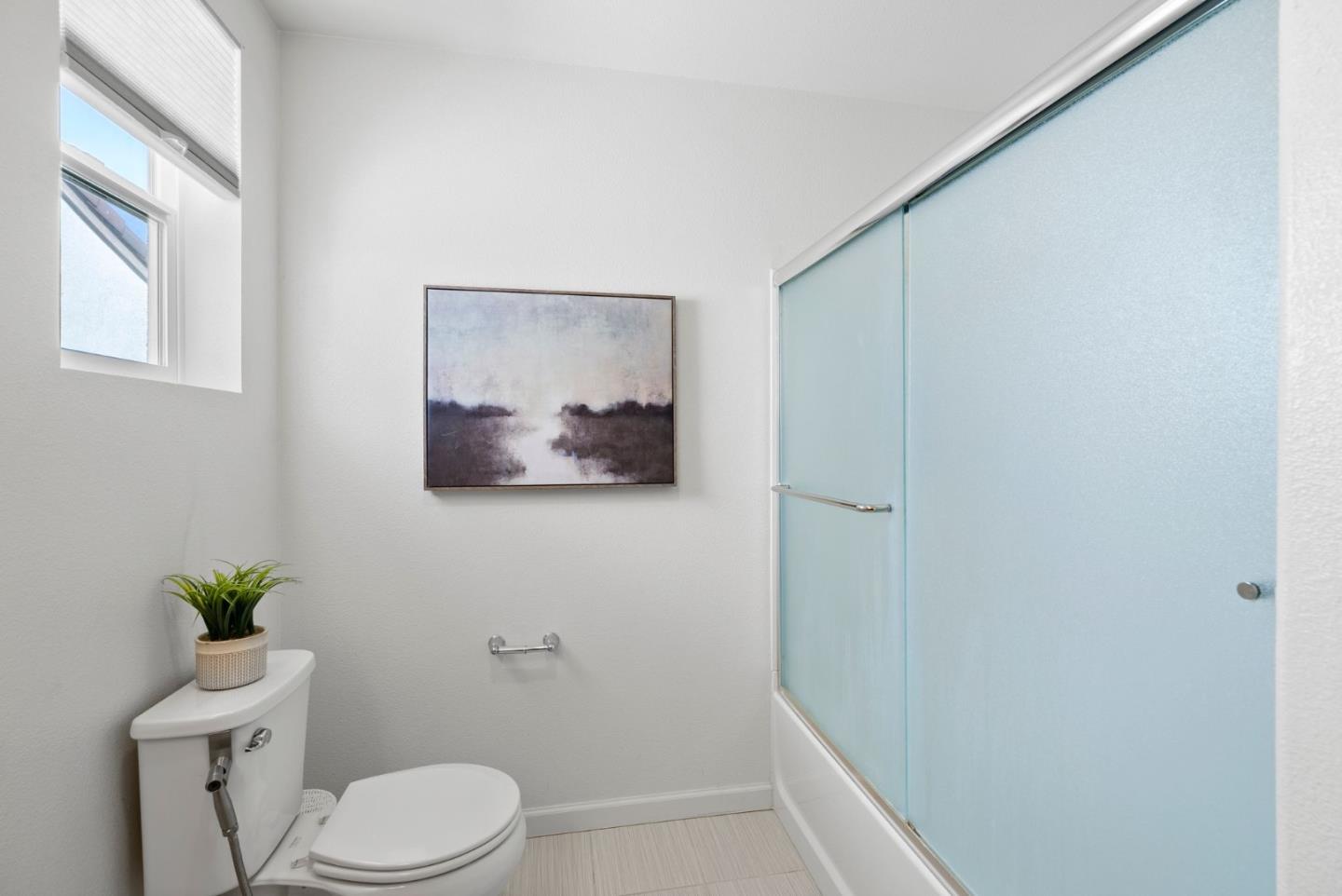 94 Caspian Way Gilroy, CA 95020 - Photo 25 of 40 a white toilet sitting next to a shower