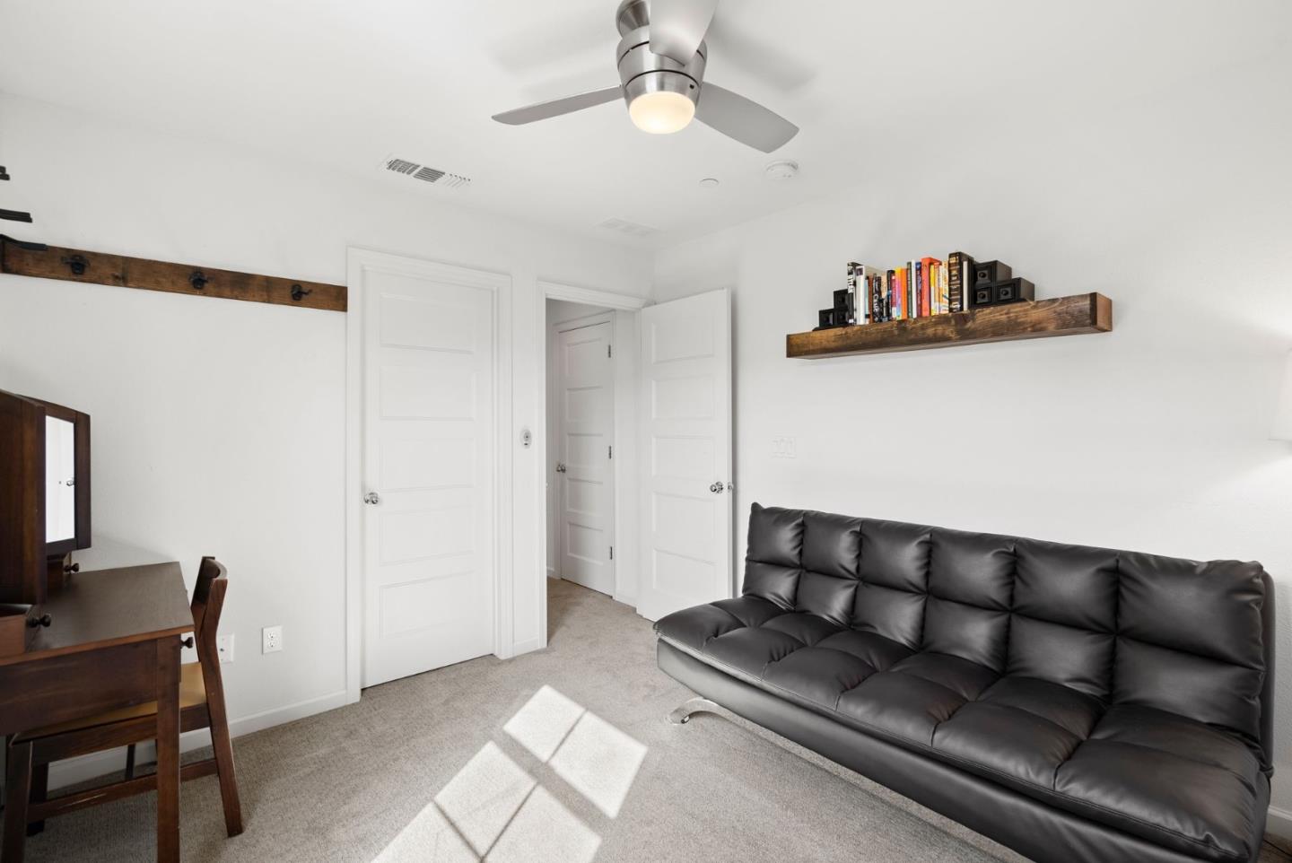 94 Caspian Way Gilroy, CA 95020 - Photo 27 of 40 a living room with furniture and a flat screen tv