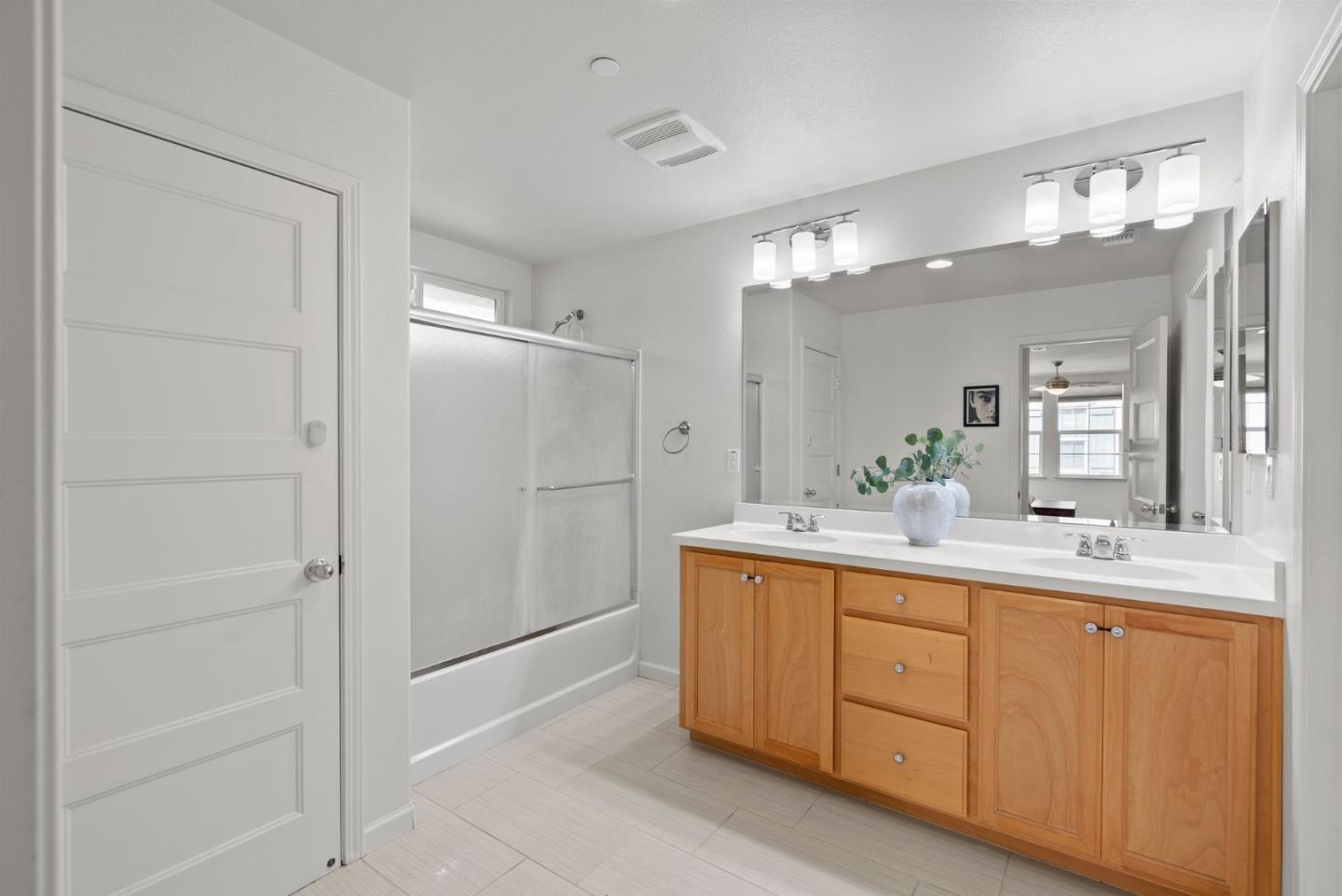 94 Caspian Way Gilroy, CA 95020 - Photo 30 of 40 a bathroom with a double vanity sink mirror and shower