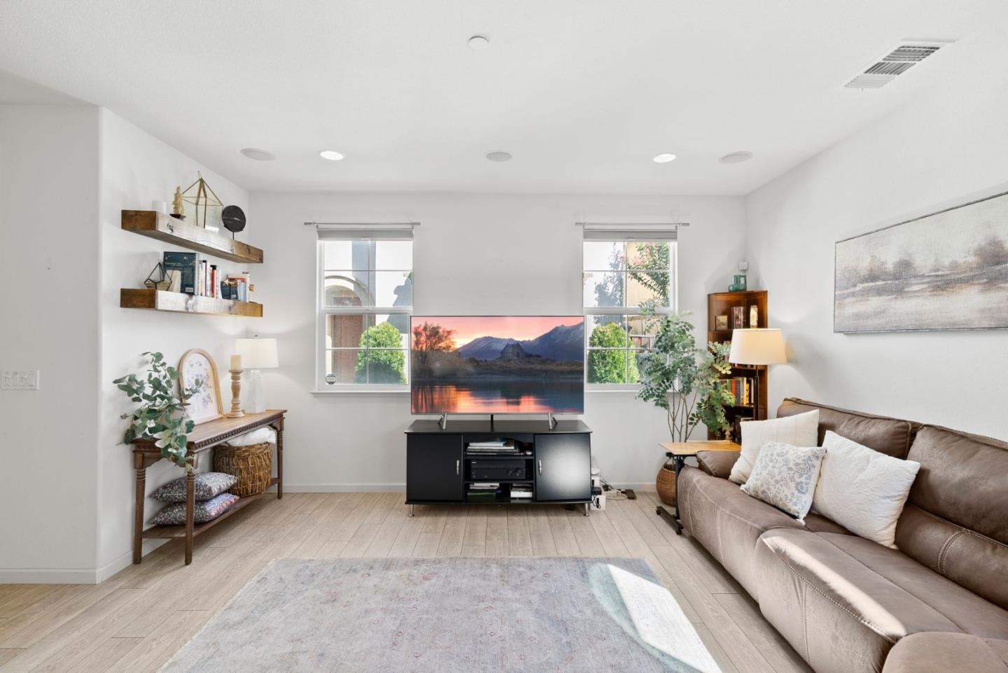 94 Caspian Way Gilroy, CA 95020 - Photo 7 of 40 a living room with furniture and a flat screen tv