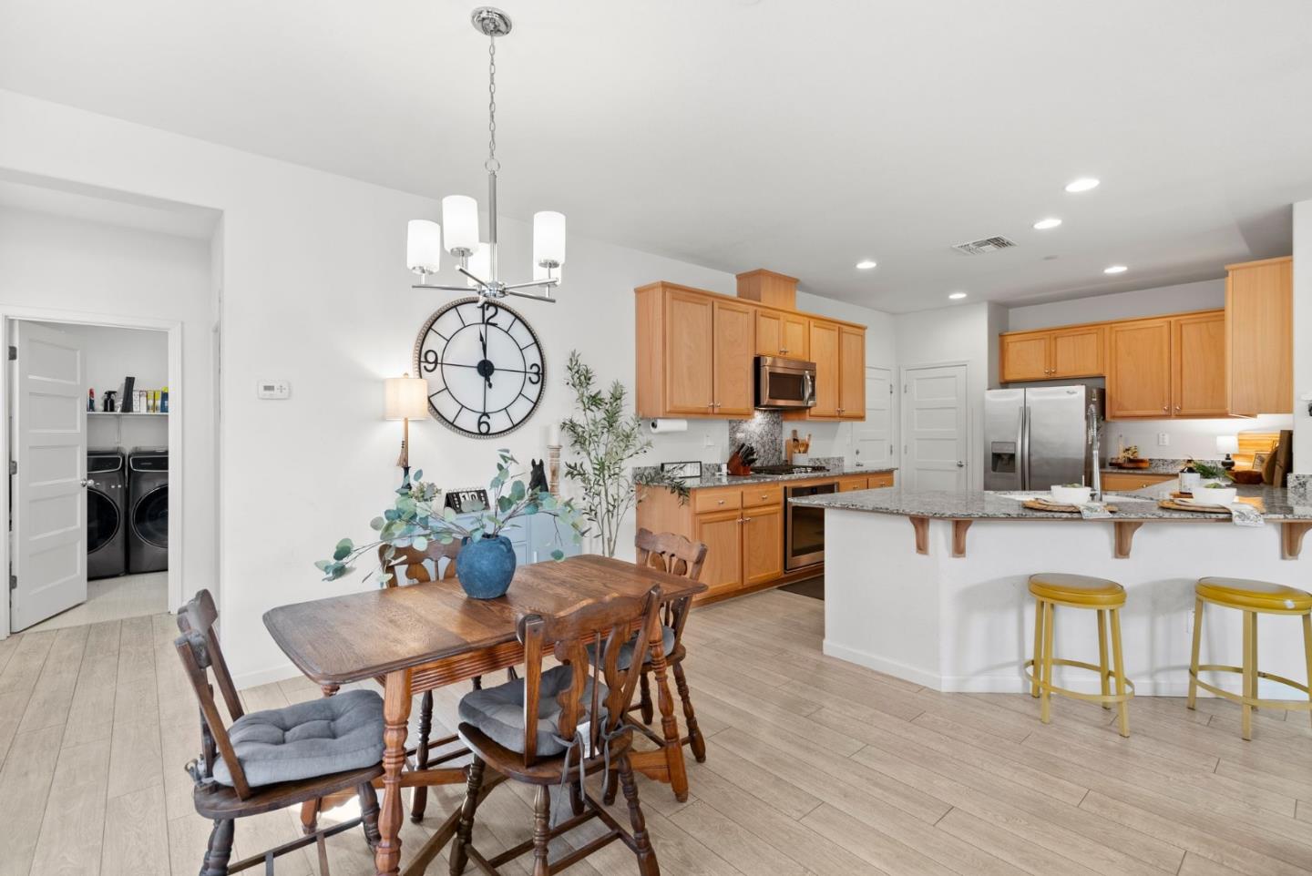94 Caspian Way Gilroy, CA 95020 - Photo 10 of 40 a view of a dining room with furniture a chandelier and wooden floor