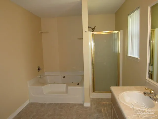 a bathroom with a bathtub and a sink