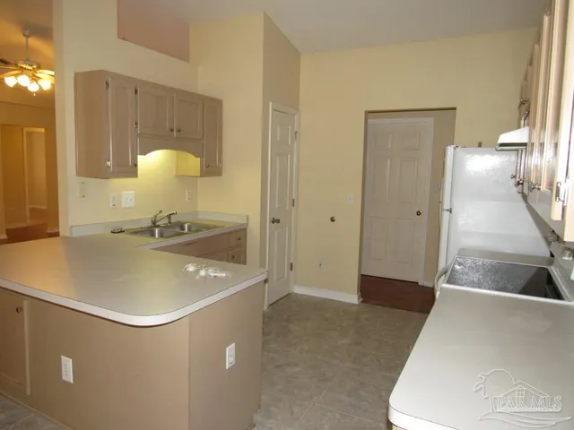 a bathroom with a sink a toilet and a shower