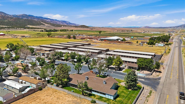 416 Kari Parowan, UT 84761 - Photo 10 of 14 Expansive property featuring multiple storage unit buildings and a residential structure with a brown shingle roof
