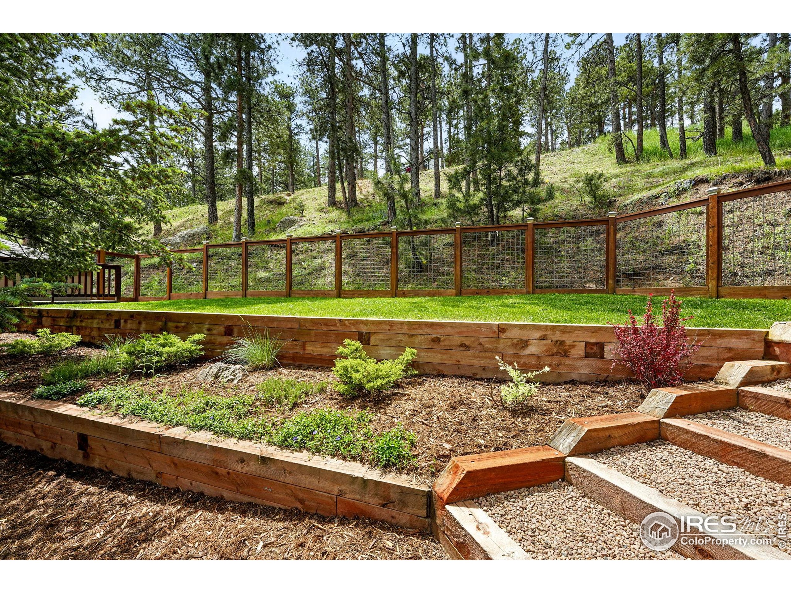 178 Balsam Lane Boulder, CO 80304 - Photo 18 of 40 a view of a yard with a wooden fence