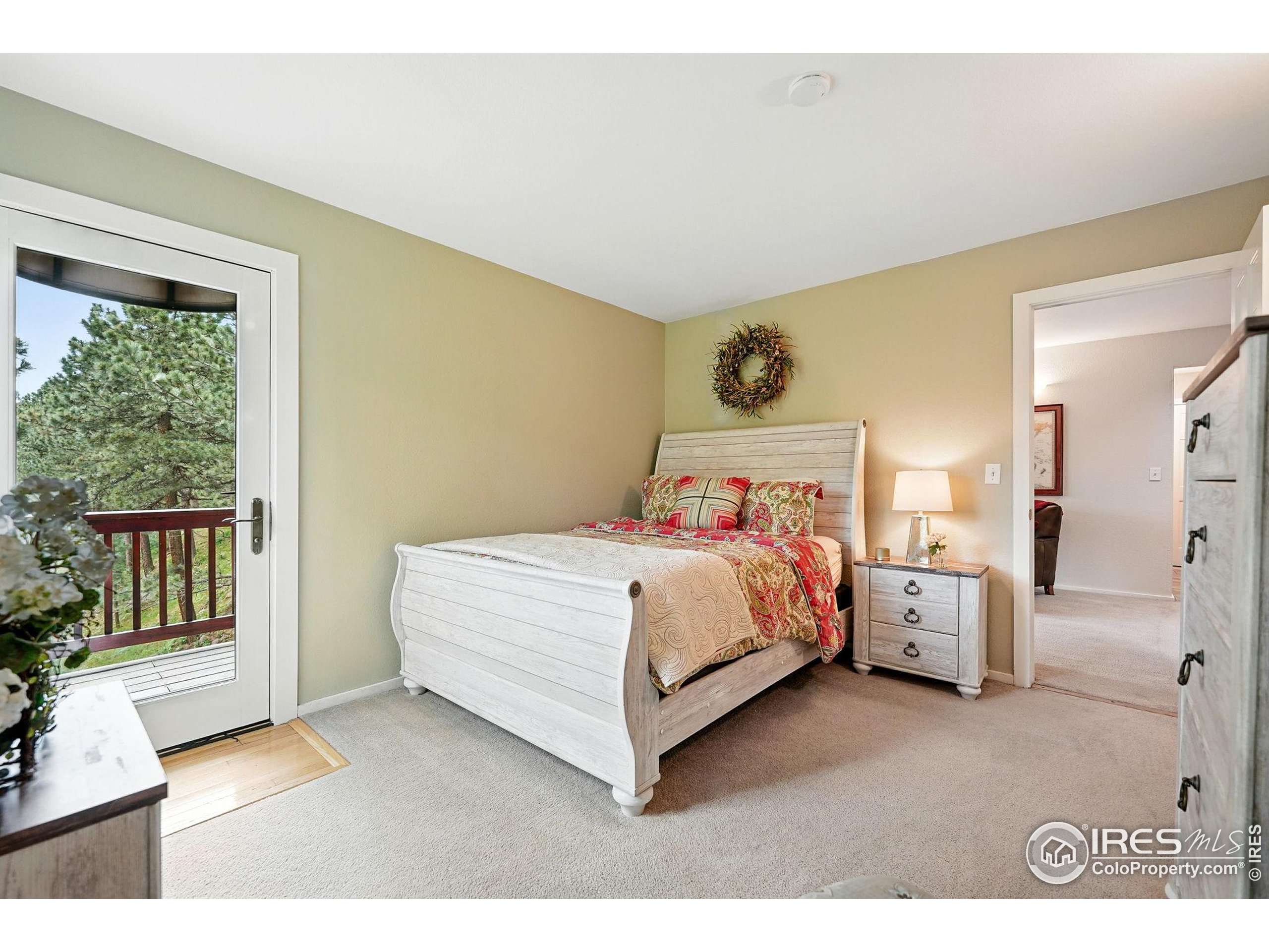178 Balsam Lane Boulder, CO 80304 - Photo 23 of 40 a bedroom with a bed and a large window