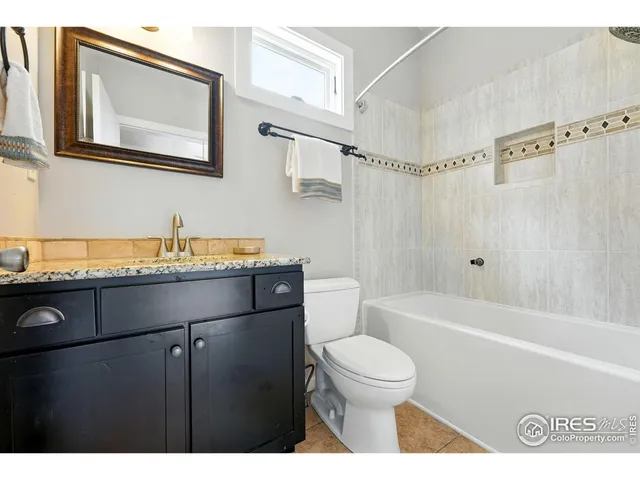 a bathroom with a sink a toilet and bathtub