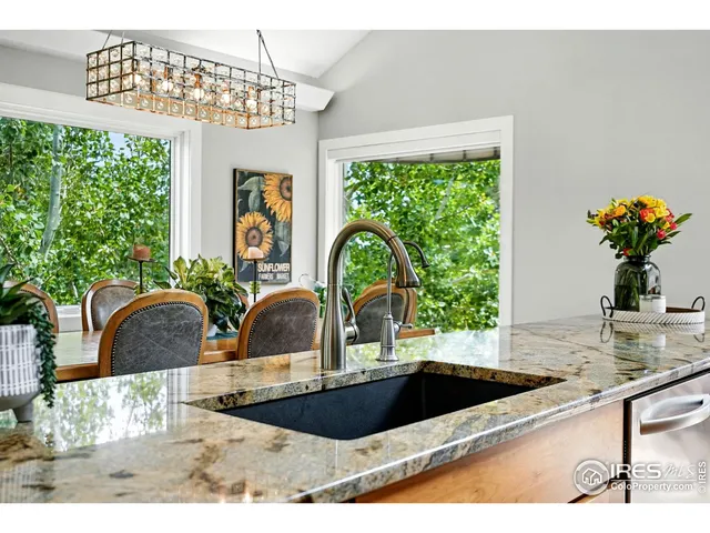 a close view of a sink a counter space and dining table