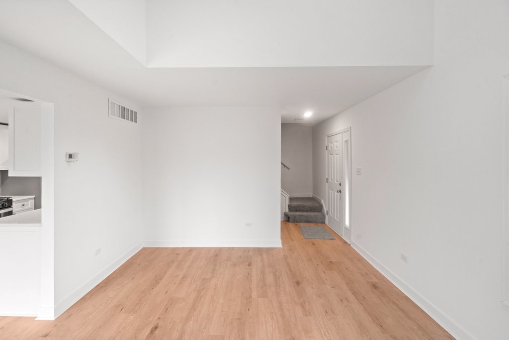 7050 Olde Gatehouse Road Tinley Park, IL 60477 - Photo 12 of 37 a view of an empty room with wooden floor