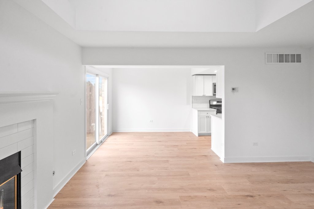 7050 Olde Gatehouse Road Tinley Park, IL 60477 - Photo 13 of 37 a view of empty room with wooden floor