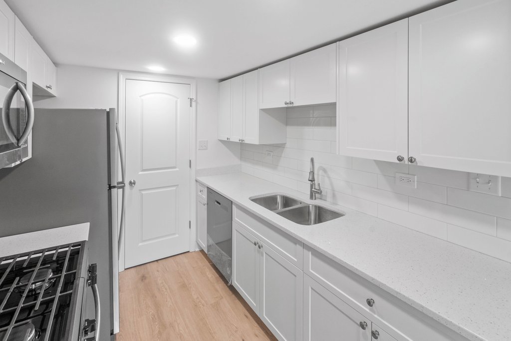 7050 Olde Gatehouse Road Tinley Park, IL 60477 - Photo 17 of 37 a kitchen with a sink and a refrigerator