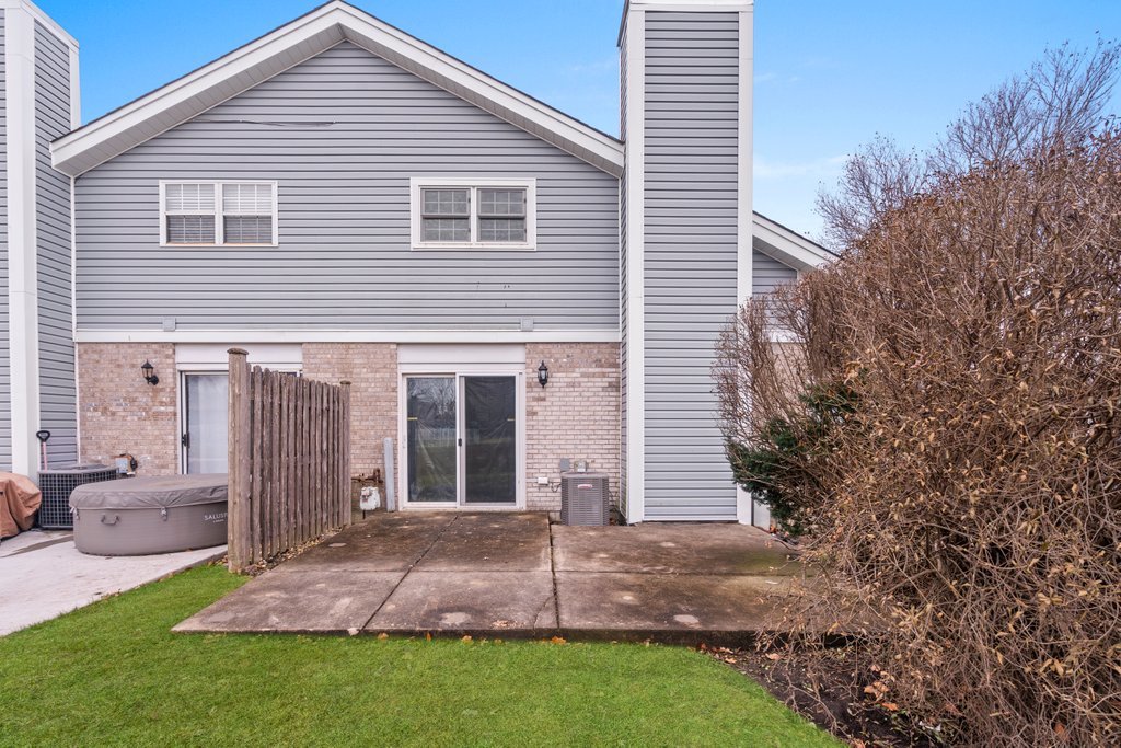 7050 Olde Gatehouse Road Tinley Park, IL 60477 - Photo 3 of 37 a view of a house with a yard and garage