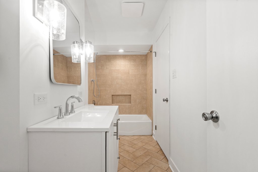 7050 Olde Gatehouse Road Tinley Park, IL 60477 - Photo 32 of 37 a bathroom with a sink a toilet and shower