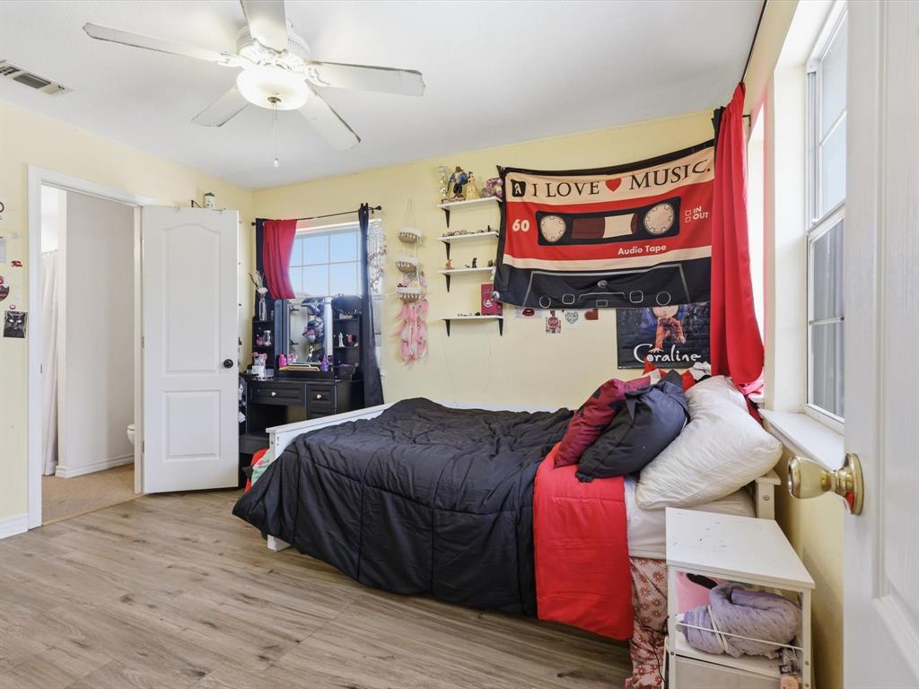 130 Parsonage Street Azle, TX 76020 - Photo 19 of 39 Bedroom featuring light wood-style flooring and ceiling fan