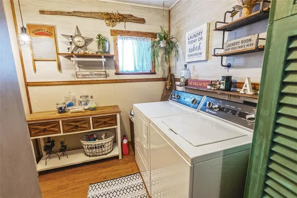 a view of a chairs and table on the balcony