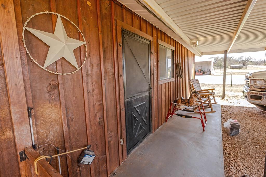 978 Longbranch Road Nocona, TX 76255 - Photo 10 of 40 a view of a porch with seating space