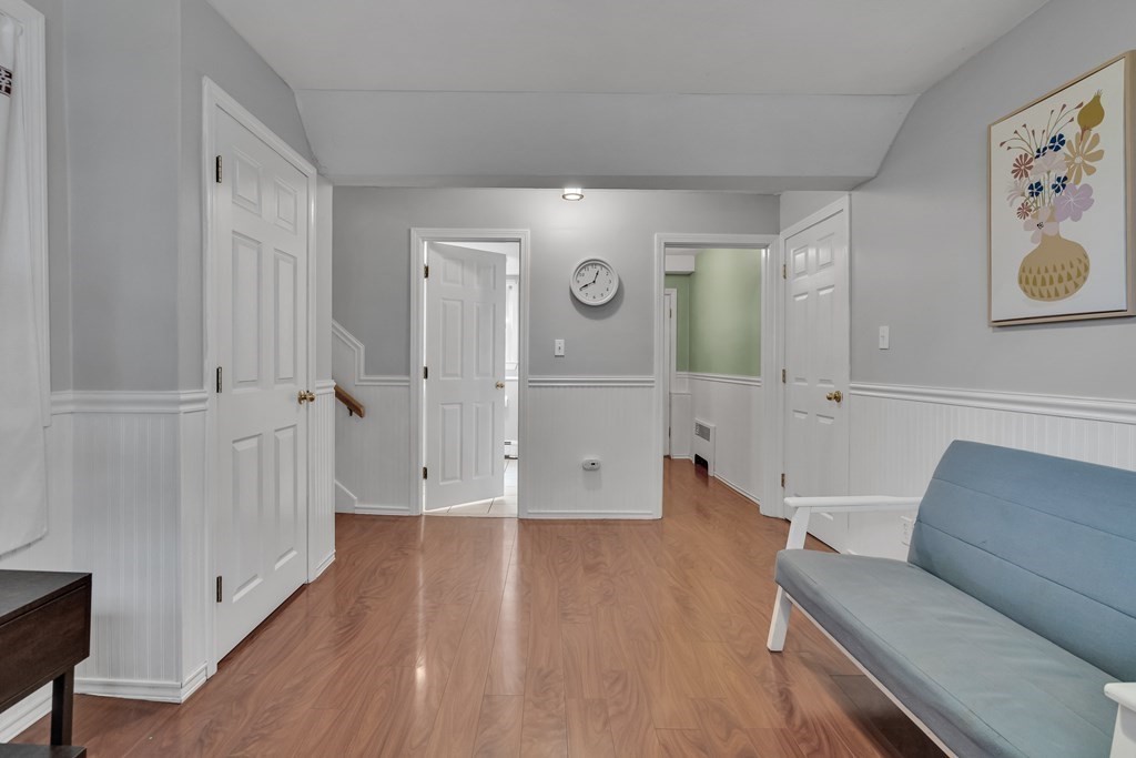 94 Stowecroft Road Arlington, MA 02474 - Photo 36 of 42 a living room with furniture and a wooden floor