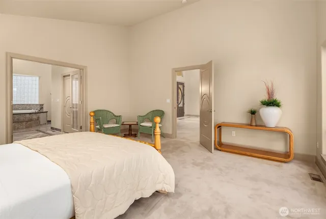 a bed room with a bed and a chair