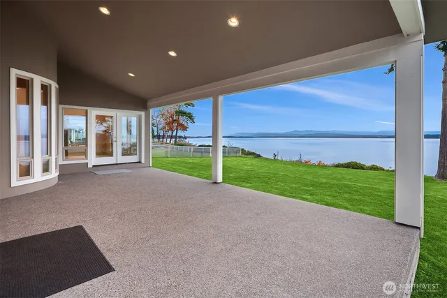 a view of a house with backyard and porch