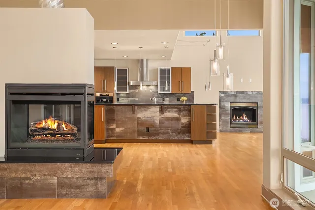 a living room with fireplace furniture and a fireplace