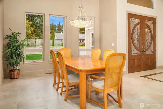 a dining room with furniture and window