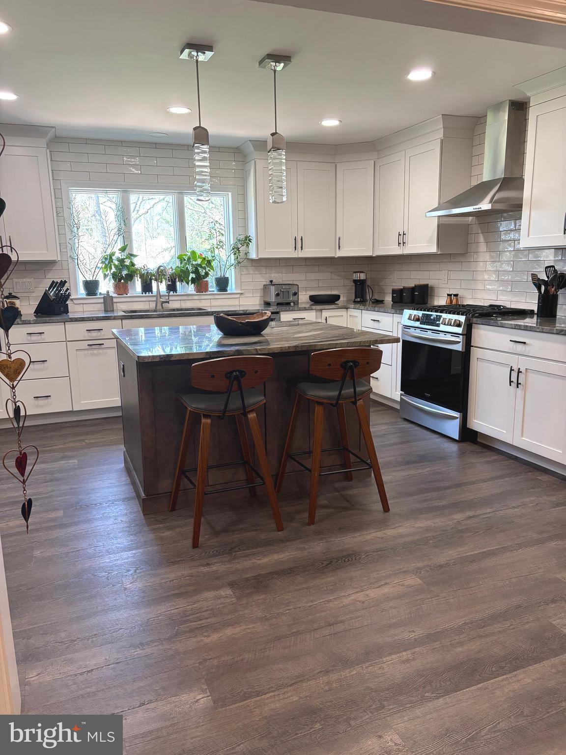 412 Greentree Road Sewell, NJ 08080 - Photo 5 of 5 a kitchen with stainless steel appliances granite countertop a table chairs sink and cabinets