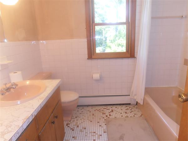 454 Dipping Hole Road Wilbraham, MA 01095 - Photo 11 of 14 a bathroom with a sink a toilet and tub