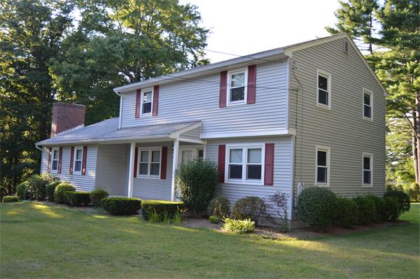 454 Dipping Hole Road Wilbraham, MA 01095 - Photo 2 of 14 a front view of a house with a yard and garage