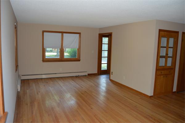 454 Dipping Hole Road Wilbraham, MA 01095 - Photo 7 of 14 an empty room with wooden floor and windows