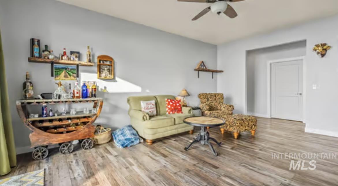 16353 Brunello Court Caldwell, ID 83607 - Photo 15 of 34 Living room with wood finished floors and a ceiling fan