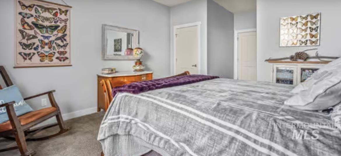 16353 Brunello Court Caldwell, ID 83607 - Photo 16 of 45 Bedroom with baseboards and light colored carpet