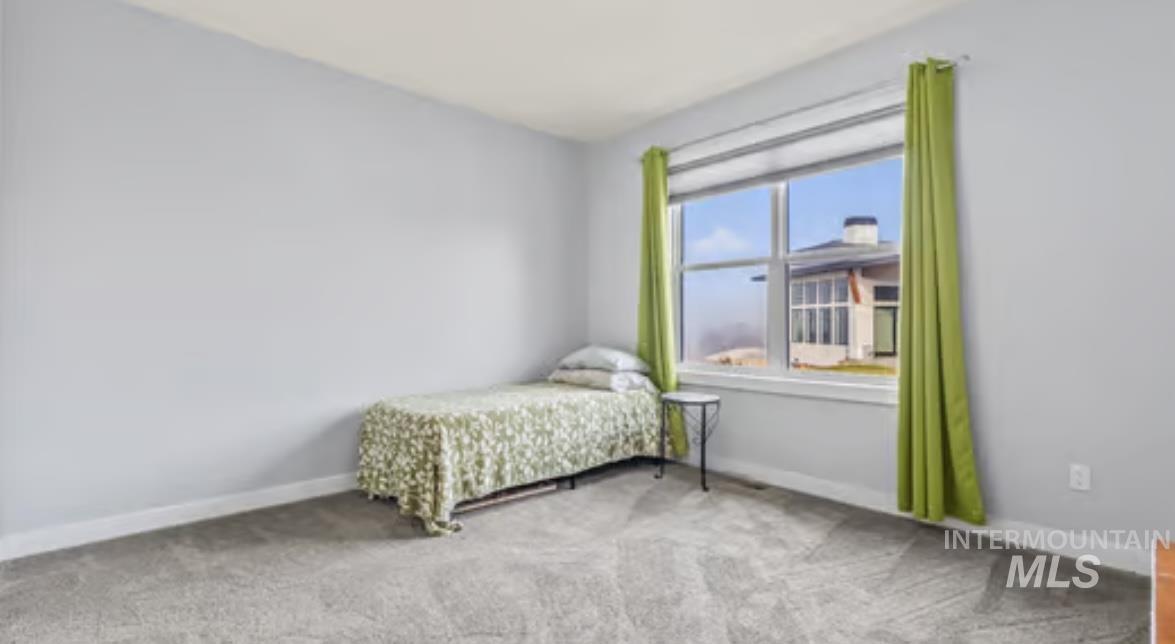 16353 Brunello Court Caldwell, ID 83607 - Photo 23 of 34 Bedroom featuring carpet and baseboards