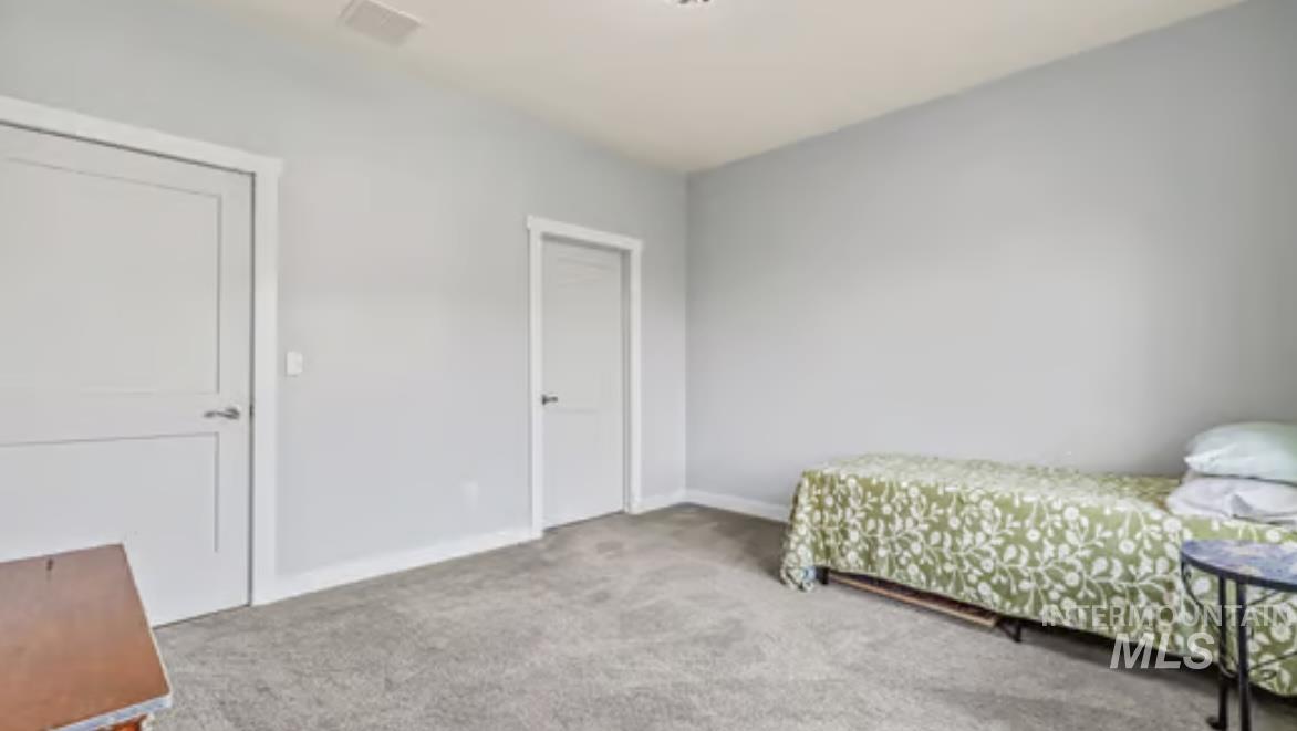 16353 Brunello Court Caldwell, ID 83607 - Photo 24 of 34 Bedroom with carpet flooring and baseboards