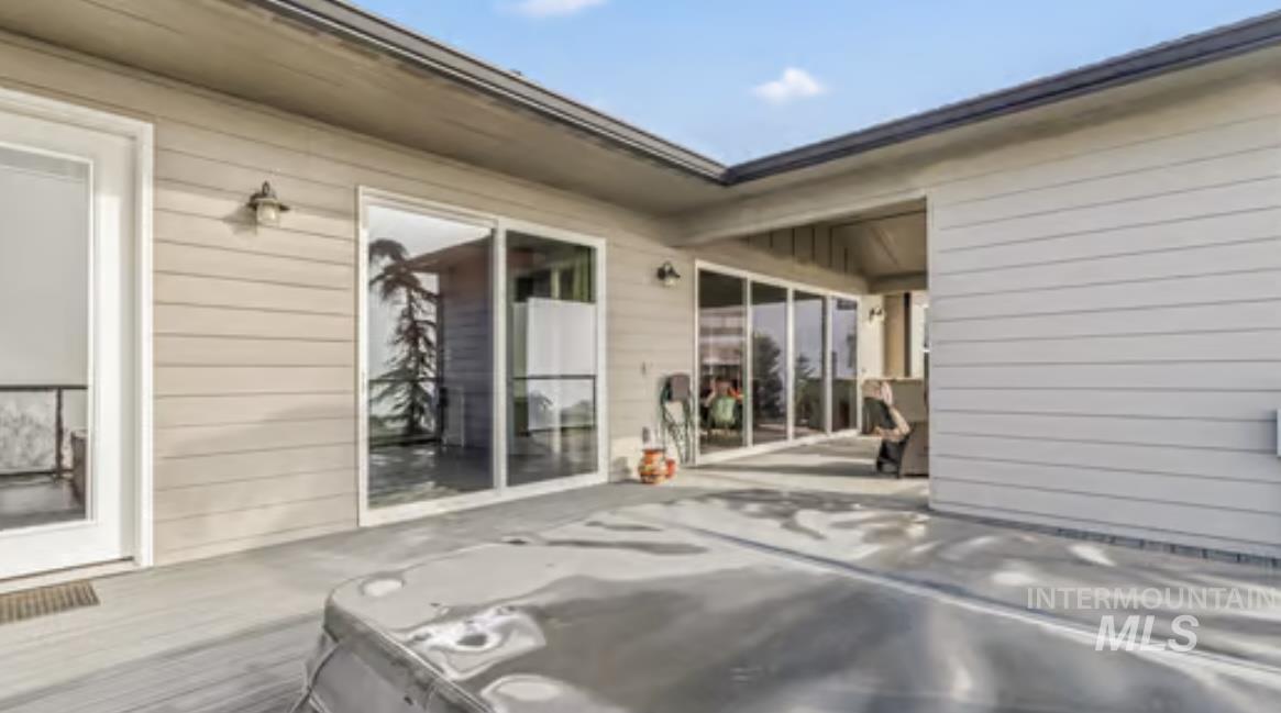 16353 Brunello Court Caldwell, ID 83607 - Photo 31 of 34 Wooden terrace with a patio area and a hot tub