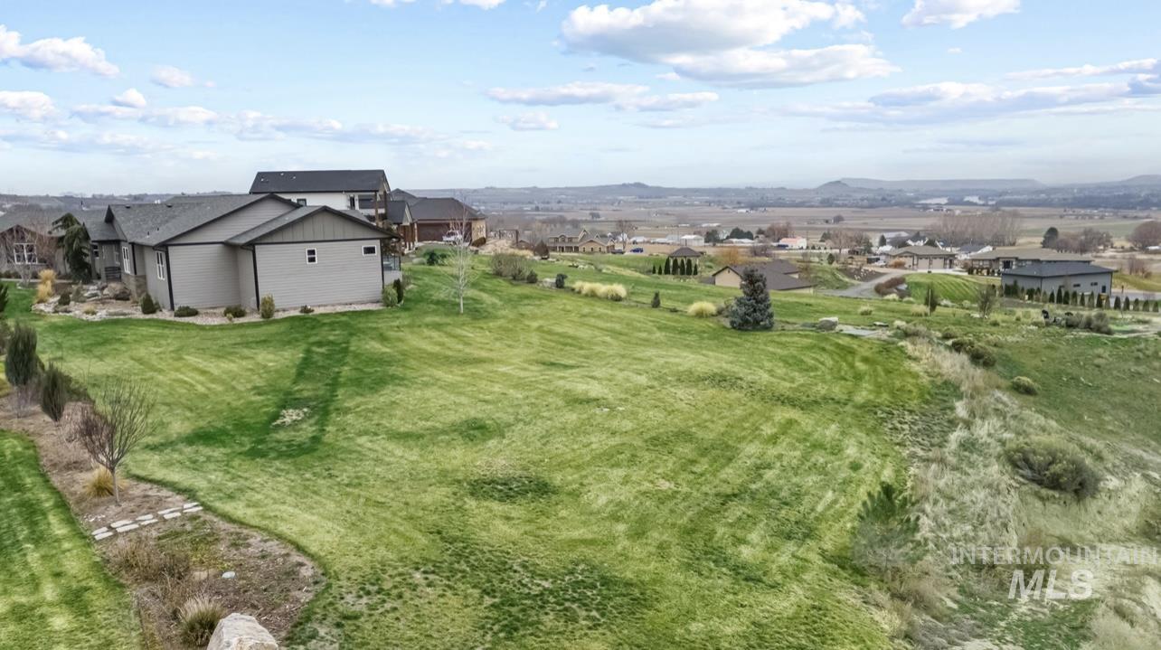 16353 Brunello Court Caldwell, ID 83607 - Photo 39 of 45 View of green lawn with a residential view