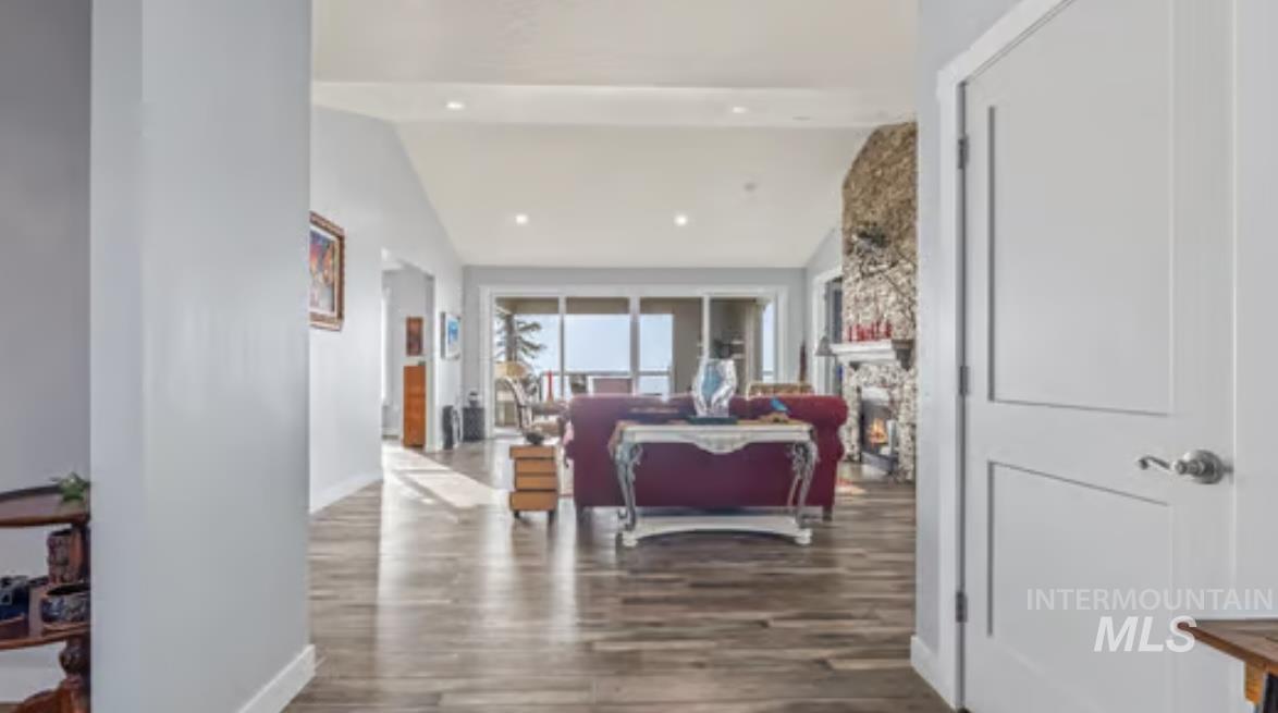 16353 Brunello Court Caldwell, ID 83607 - Photo 5 of 45 Corridor featuring vaulted ceiling and dark wood-style flooring