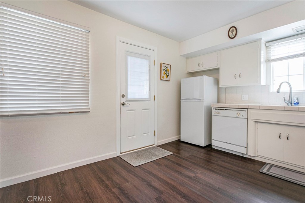 13166 Aztec Street Sylmar, CA 91342 - Photo 16 of 48 a view of a kitchen with wooden floor and electronic appliances