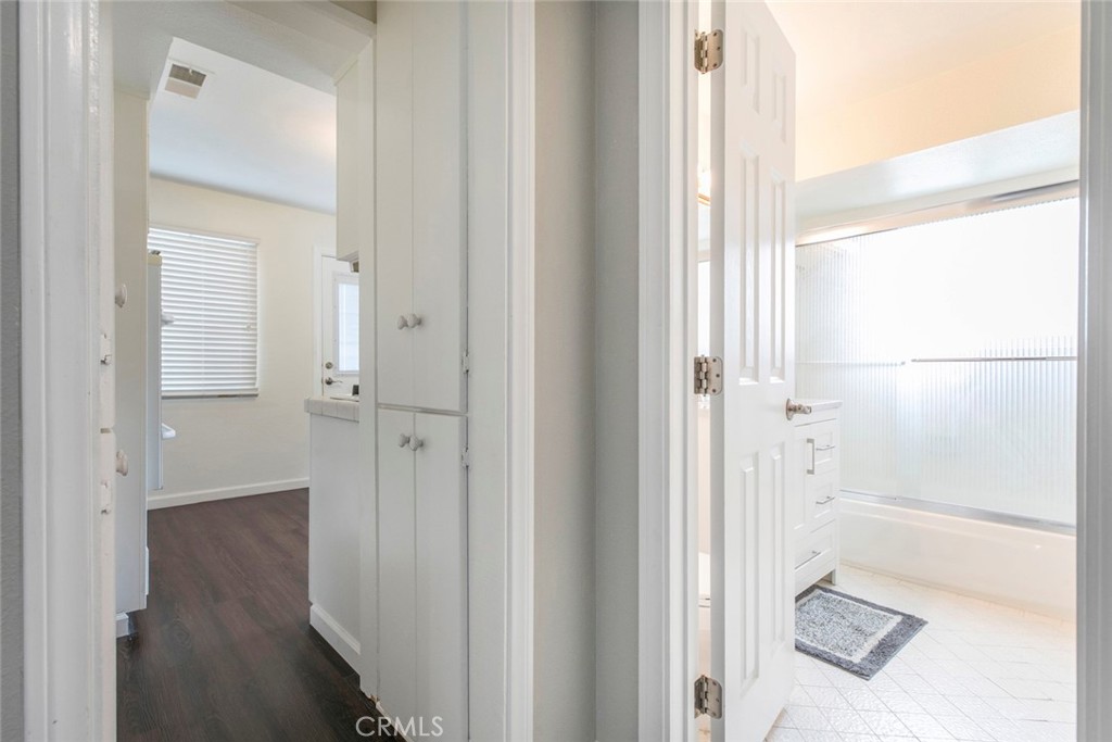 13166 Aztec Street Sylmar, CA 91342 - Photo 18 of 48 a bathroom with a glass shower door