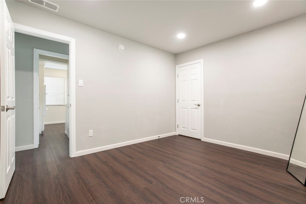 13166 Aztec Street Sylmar, CA 91342 - Photo 22 of 48 a view of an empty room with wooden floor