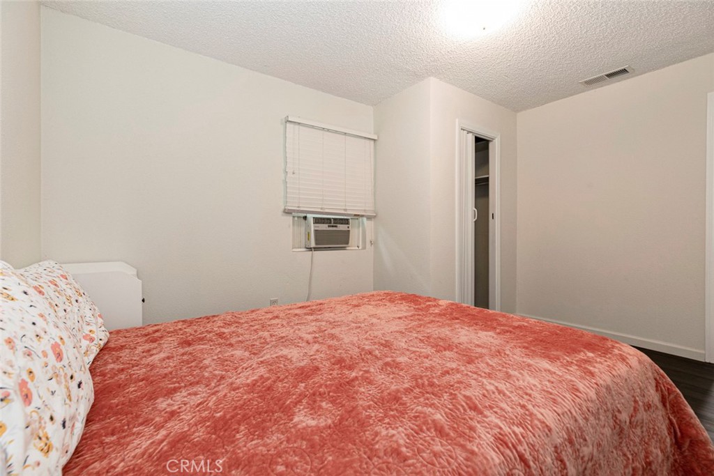 13166 Aztec Street Sylmar, CA 91342 - Photo 25 of 48 a bedroom with a bed and a window